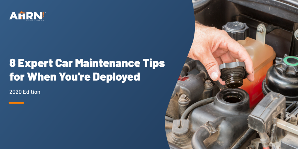 A hand holding a knob that goes to the engine oil filler