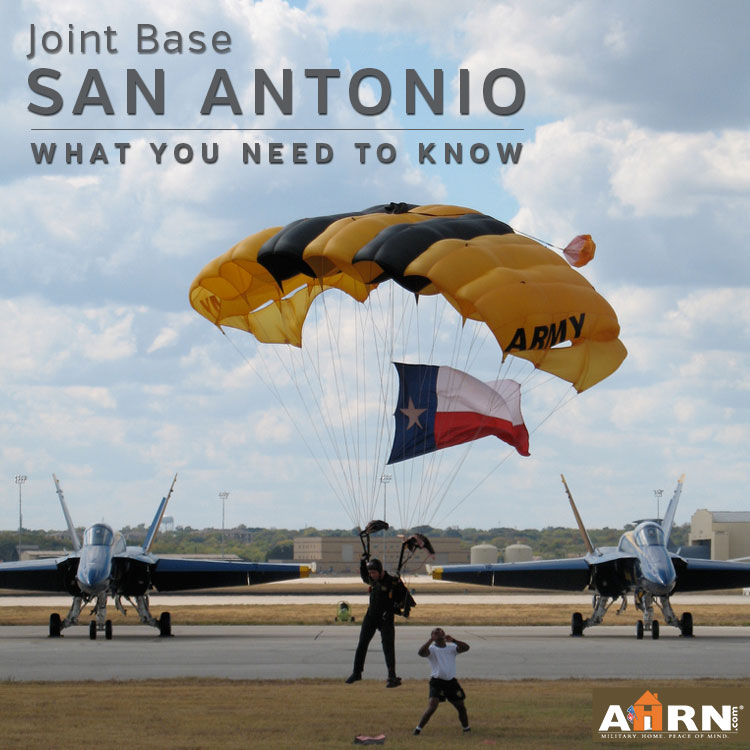 Guy with a parachute standing next to airplanes