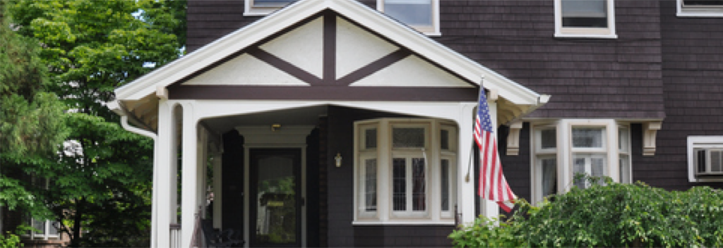 Front of house with a flag hanging